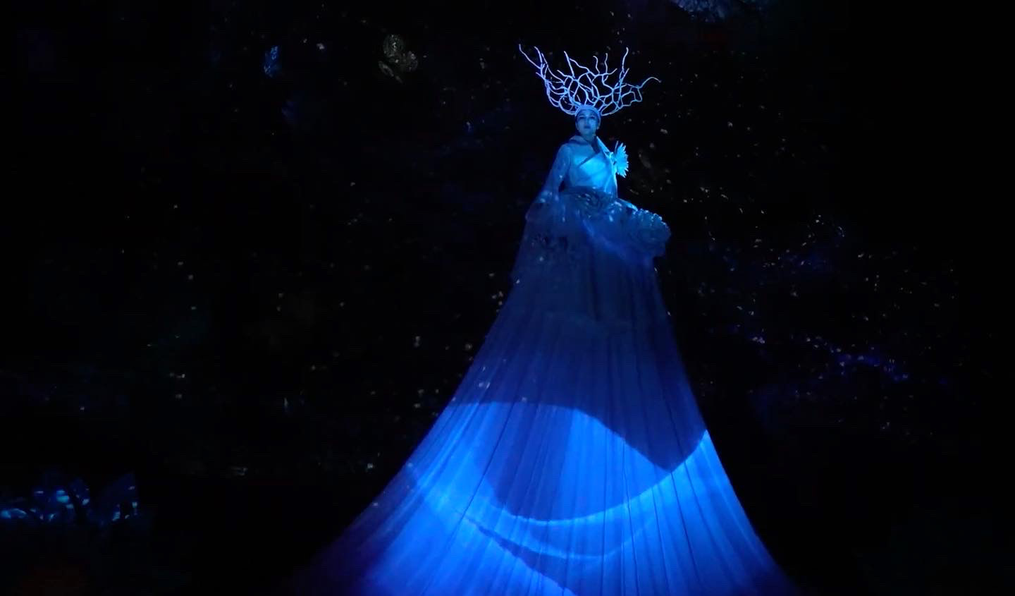 God's Cave — performer illuminated inside Manjanggul lava tube